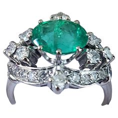 Vintage 18k white gold ring centered with natural green emerald estimate weight of 2 carats colombian green color flanked with brilliant cut diamonds H color white estimate weight 0.60 carats Diamond Gold Ring, Diamond Gold, White Gold Ring, Green Emerald, Gorgeous Jewelry, Gold Diamond Rings, Emerald Diamond, 2 Carat, Brilliant Cut Diamond