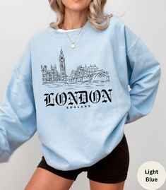 Stay cozy in our Unisex London Sweatshirt! Embrace city vibes with this stylish London Hoodie. Perfect travel sweatshirt and London gift souvenir, featuring iconic London England design. 🇬🇧  ✦ KEY FEATURES Gildan 18000 ADULT Crewneck Sweatshirt UNISEX (NOT WOMEN'S SIZE) heavy blend crewneck sweatshirt made from 50% Cotton and 50% Polyester. Loose fit, runs true to size. Strong, resistant to most chemicals, stretching and shrinking.  ✦ KEY FEATURES Gildan 18500 ADULT Pocketed Hoodie UNISEX (NOT WOMEN'S SIZE) heavy blend hooded sweatshirt made from 50% Cotton and 50% Polyester. Classic fit, RUNS TRUE TO SIZE. Medium-heavy fabric. Polyester fibers are extremely resilient, resistant to most chemicals, stretching, and shrinking. ✦ SIZING Please refer to the sizing chart in the pictures above London Sweatshirt, London Hoodie, Travel Sweatshirt, City Sweatshirt, London Gifts, City Vibes, Iconic London, City Vibe, Pocket Hoodie