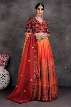 Be a vision of style and elegance on wedding celebrations in this stunning maroon and orange printed and embroidered lehenga with dupatta. Shop Indian dresses in USA from Pure Elegance. Festive Orange Lehenga With Intricate Embroidery, Orange Semi-stitched Choli With Intricate Embroidery, Semi-stitched Orange Choli With Intricate Embroidery, Designer Orange Lehenga With Intricate Embroidery, Orange Lehenga With Intricate Embroidery For Festivals, Anarkali Orange Lehenga With Intricate Embroidery, Festive Orange Embroidered Lehenga, Bollywood Style Embroidered Orange Lehenga, Orange Choli With Intricate Embroidery For Festivals