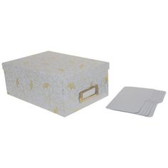 a white box and coasters with gold designs