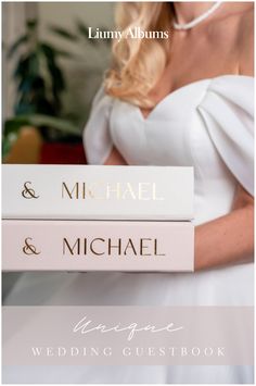 the wedding guest book is stacked on top of each other, and features two names