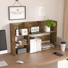 a desk with a computer and books on it