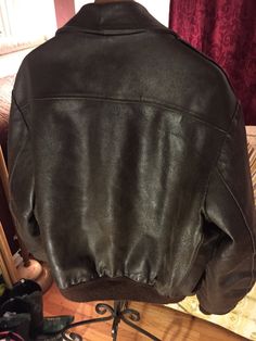 "This vintage jacket is warm and will help keep the weather out. Quilted lined for warmth and a beautiful dark brown color, the leather is aged and shows vintage wear for a perfect worn in look. Men's size 50 tall -Model size men's Large Approximate measurement when laid flat: 28\" armpit to armpit 21\" shoulder to shoulder 27\" sleeve 29\" back of collar to hem" Rugged Brown Outerwear With Padded Collar, Classic Brown Leather Jacket For Winter, Classic Brown Leather Jacket With Padded Collar, Classic Vintage Brown Leather Jacket, Rugged Brown Sport Coat For Winter, Classic Winter Leather Jacket In Distressed Brown, Classic Distressed Brown Leather Jacket For Winter, Classic Brown Outerwear With Padded Collar, Classic Distressed Brown Outerwear For Fall