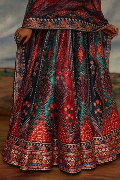 Multi color blouse with tribal print and threads, beads embroidery. Paired with coordinating lehenga and dupatta. - Aza Fashions Multicolor Lehenga With Intricate Embroidery For Festive Occasions, Multicolor Embroidered Lehenga With Traditional Drape, Anarkali Choli With Intricate Embroidery In Multicolor, Multicolor Anarkali Set With Intricate Embroidery For Festivals, Multicolor Lehenga With Intricate Embroidery, Multicolor Semi-stitched Choli With Intricate Embroidery, Multicolor Semi-stitched Embroidered Choli, Multicolor Intricate Embroidery Sharara For Festivals, Multicolor Sets With Intricate Embroidery For Festivals