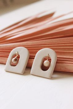 Welcome to house & honey. Our archway earrings in the colour sand, are part of our SS 2023 Collection. Inspired by movement, interior design and organic elements, they're unique and just plain fun to wear. The oversized studs create a statement without being over the top. Made with speckled polymer clay and wood jasper beads. They're super lightweight and very comfortable to wear. They will easily become your go-to pair this season. To see the rest of this collection, visit here https://www.etsy Everyday Beige Dangle Earrings, Beige Drop Earrings For Gift, Beige Drop Earrings As A Gift, Polymer Clay Bead Earrings, Minimalist Polymer Clay Earrings, Clay Studs, Organic Elements, Gemstone Drop Earrings, Jasper Earrings