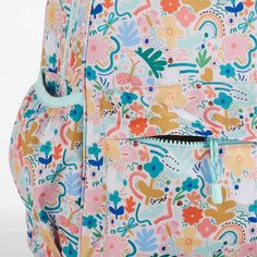 A floral backpack that's extra comfy and ready to handle daily adventures. Patterned with a colorful collection of garden friends that flit and flutter over the white exterior, the kids' large knapsack is constructed of supremely durable polyester made from recycled water bottles. A roomy interior holds everything your kid needs-books, school supplies, extra layers-and there's a padded pocket to keep their tablet protected. Outside pockets hold snacks, water bottles and more. Pair this book bag White School Backpack For Spring, Spring Floral Print Standard Backpack, Floral Print Backpack For School In Spring, White Backpack For Spring, Playful Bags For Spring Playtime, Multicolor Floral Print School Bags, Green Spring Backpack, Spring Green Backpack, Spring Green Standard Backpack