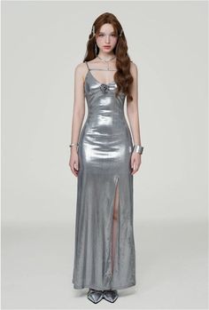 Radiate confidence in our Metallic Sheen Slip Dress, designed for a sleek and bold statement.
Made with a blend of polyester and spandex, this dress offers a comfortable fit with a touch of stretch, perfect for accentuating your silhouette. The thigh-high split adds a flirtatious edge to the elegant shape, while the subtle shimmer of the metallic fabric ensures you stand out in any setting.
Pair this slip dress with strappy heels for a glamorous evening look, or layer it with a tailored blazer f Class Dress, Pose References, Metallic Fabric, Tailored Blazer, Maxi Gowns, Silver Dress, Urban Wear, Strappy Heels, Thigh High