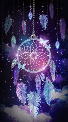 an image of a dream catcher with feathers flying through the air and stars in the sky