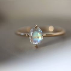 Moonstone Engagement Ring, Oval Cut Moonstone Ring, 14k Rose Gold Ring, Rainbow Moonstone Promise Rings, June Birthstone Ring Moonstone Ring   Main Stone: Moonstone  Main Stone Color: Colorless Main Stone Shape: Oval Birth Month: June S I L V E R J E W E L R Y C A R E Silver is not the best friend of oxygen and sulfur; it can be oxidized and tarnished from time to time it is the nature of silver. To keep the silver shiny and prevent it from oxidizing fast, we would recommend the following instructions; * Avoid any chemical agents including perfume, makeup, and hair spray. * Avoid wearing silver jewelry to the beach, shower, or exercise. * Remove before you sleep, clean it with a silver cloth, and keep it in a dry area or in a small zip-lock package. G E M S T O N E C A R E Major semi-preci Engagement Ring Oval Cut, June Birthstone Ring, Ring Moonstone, Manifesting Abundance, Moonstone Engagement, Moonstone Engagement Ring, Moonstone Stone, Etsy Gold Ring, 14k Rose Gold Ring