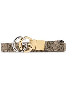 light beige/multicolour canvas/leather smooth grain GG Supreme canvas front buckle fastening reversible logo-buckle detail engraved logo thin strap punched holes round tip adjustable fit We've partnered with Good On You — an independent agency that rates how brands perform in relation to their impact on the planet, people and animals, with a multi-criteria rating simplified to a five points scale. In order to be awarded our conscious label, larger brands need to score a minimum of four out of five ('Good'), while smaller brands must score at least three out of five ('It's A Start'). This item comes from a brand rated three out of five ('It's A Start') by Good on You at the time it was added on FARFETCH. Please note, this is a brand-level rating and does not guarantee that this product is m Planet People, Gucci Gg Marmont, Buy Gucci, Reversible Belt, Five Points, Gg Marmont, Demi Fine Jewelry, Gucci Belt, Engraved Logo