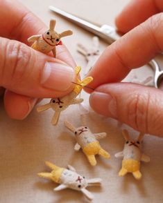 someone is working on some tiny animals with scissors