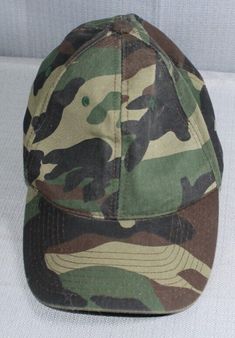 a camo baseball cap on a white background