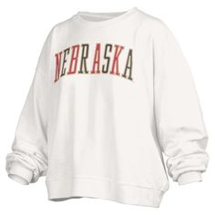 The Women's Pressbox White Nebraska Huskers Janise Waist Length Oversized Pullover Sweatshirt is the perfect way to show your support for the Nebraska Huskers. This oversized sweatshirt features a cropped hem that hits at waist length, a fleece lining for warmth, and dropped shoulders for a relaxed fit. Sequin graphics add a touch of sparkle to your game-day look. Whether you're cheering on the Huskers at the stadium or relaxing at home, this sweatshirt will keep you comfortable and stylish. White Oversized Sweatshirt For Sports Season, White Crew Neck Sweatshirt For Sports Season, Nebraska Football Shirts, Nebraska Huskers Svg, Nebraska Huskers Shirt, Nebraska Huskers, Waist Length, Oversized Pullover, Oversized Sweatshirt