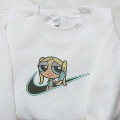 Bubbles x Nike Embroidered Shirt, Custom Nike Embroidered Shirt, The Powerpuff Girl Embroidered Shirt Step into the charming world of Tinicloset, your ultimate destination for enchanting custom embroidered shirts and apparel that will awaken your inner child and add a sprinkle of sweetness to your wardrobe. We take pride in offering a curated collection of embroidered treasures, each designed to capture the essence of childhood wonder and nostalgia. Allow us to introduce you to our standout crea Cute White Top With Machine Embroidery, Cute White Tops With Machine Embroidery, Cute White Top With Embroidered Logo, Cute White Tops With Embroidered Logo, Embroidered Shirts, Powerpuff Girl, The Powerpuff, Custom Nike, Custom Nikes