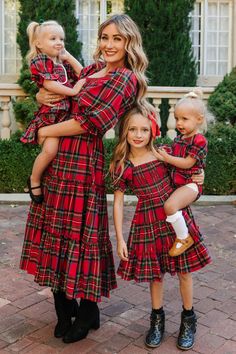 SHE'S BACK!! Our all-time favorite Madeline Dress in Holiday Plaid. Featuring our best-selling silhouette and a festive plaid print! Flowy, feminine, and functional. Everything this carefree midi-length women's dress is made of. Inspired by family time, fireplaces, and cozy evenings with friends. Smocked bodice with puff sleeves and ruffle details finish it off. Available in matching looks for the whole family! Matching Christmas Dresses, Mom Daughter Christmas Outfits, Tartan Holiday Outfit, Holiday Family Pictures Outfits, Christmas Family Outfits For Pictures, Santa Pictures With Kids Outfits, Christmas Family Photos Outdoor Outfits, Christmas Tree Farm Family Photos Outfit, Mommy And Me Christmas Outfits