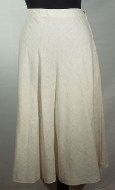 This is a fresh, original and unique rayon, flax and polyester off white, ecru A line boho 1970's vintage Sears label midi skirt. This vintage wardrobe staple, keeper of a neutral skirt is very well constructed. It has a high waist band and hidden zipper and button closure with a hemline that falls below the knees. It also has a wonderful leisure boho 70s look and the great collectible vintage SEARS label. It is in great pre-loved vintage condition with normal signs of wear/use and no major dama Spring Bohemian A-line Bottoms, Classic Off White Bottoms For Spring, Spring A-line Bohemian Bottoms, Bohemian A-line Bottoms For Spring, Fitted Vintage Linen Bottoms, Bohemian A-line Bottoms For Summer, Bohemian A-line Summer Bottoms, Fitted Linen Bohemian Bottoms, Fitted Bohemian Linen Bottoms