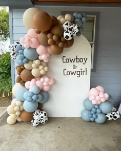 there is a sign that says cowboy or cowgirl with balloons all over the front