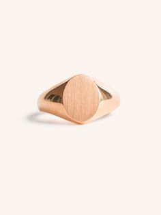 Add a personal touch to your style with our Oval Signet Ring. Its elegant, brushed finish gives a sophisticated look while the oval shape adds a modern twist. Plus, it can be engraved for a unique and meaningful touch. Timeless Oval Engraved Ring For Formal Occasions, Classic Matte Finish Jewelry Gift, Luxury Oval Signet Ring For Everyday, Minimalist Oval Rose Gold Ring, Minimalist Rose Gold Oval Ring, Modern Oval Cabochon Signet Ring For Formal Occasions, Classic Rings With Brushed Finish As Gift, Minimalist Rose Gold Signet Ring For Formal Occasions, Classic Ring With Brushed Finish As A Gift