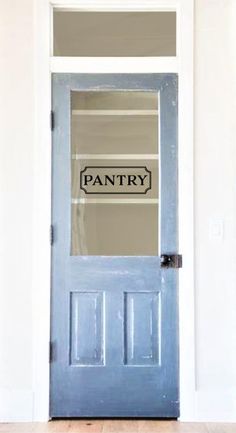 an empty pantry door with the word pantry painted on it's glass front door