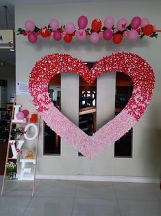 a large heart shaped decoration in the middle of a room