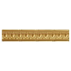 an ornate gold finish on a white wall with circles in the center and round design