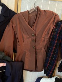 "Lot of 1940's and 1950's ladies blazers. 6 in total. Overall good vintage contain, but some have imperfections 1. Red black and blue plaid wool blazer with spots of white. 34/35\" bust, 30\" waist, shoulder to hem is 21\". Many moth holes, largest is in the left shoulder 2. Olive green cropped pullover top with white yarns and half sleeves. 38\"bust, shoulder to hem 18\" 3. 1940's light brown blazer with delicate gold buttons. Slightly reflective material. 42/44\" bust, 34\" waist, 22\" shoulde Fall Season Semi-formal Collared Blazer, Semi-formal Fall Collared Blazer, Fall Formal Collared Blazer, Vintage Spring Outerwear For Office, Long Sleeve Outerwear With Button Closure In Vintage Style, Vintage Spring Office Outerwear, Fall Vintage Fashion Single-breasted Outerwear, Vintage Double-breasted Blazer For Spring, Retro Long Sleeve Semi-formal Outerwear