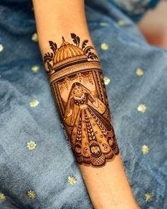 a woman's arm is decorated with hennap and an ornate design on it