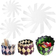 three baskets with different designs on them, one has scissors and the other has pencils