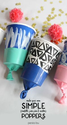 three cups with different designs on them and the words simple poppers in front of them