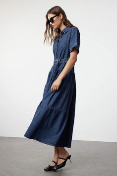 Stylish Belted Blue Jean Maxi Dress | Trendy Belted Jean Dress | Mid-Sleeve Belted Jean Dress | Knee-Length Casual Shirt Collar Denim Dress ✔️Colors may vary due to light differences in studio shootings. ✔️Wrinkles may occur during the shipping process. After receiving your clothing, you can wear it neatly like the model if you use a steam iron afterward. ✔️Model's Measurements: Height: 174 cm (5'9'') Bust: 83 cm (32 in) Waist: 60 cm (23 in) Hips: 89 cm (35 in) The model is wearing a size S/36/8 Blue Casual Maxi Length Shirt Dress, Blue Casual Maxi Shirt Dress, Dark Wash Relaxed Fit Short Sleeve Denim Dress, Dark Wash Relaxed Fit Denim Dress With Short Sleeves, Relaxed Fit Casual Maxi Dress For Work, Casual Relaxed Fit Maxi Dress For Work, Relaxed Fit Denim Shirt Dress With Short Sleeves, Casual Fitted Maxi Denim Dress, Casual Fitted Maxi Length Denim Dress