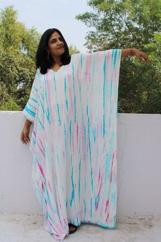 For more robes, kaftan, custom dresses  please visit our homepage- https://www.etsy.com/shop/mommyrobeclothing SALE-  BUY 1 AVAIL 10% OFF,BUY 2 AVAIL 15% OFF, BUY 3 AVAIL 20% OFF ..coupon showed doing check out. All dresses are custommade- ONLY FOR YOU! Tiedyed Kaftan,RAYON Caftan, Long Robe, Summer Dress, Long Maxi, Loungewear, beachwear, Maternity Dress, Holiday, Vacation Wear The beauty of this kaftan is - -EXCLUSIVE AND UNIQUE PRINT. -This lovely Indian hand tie-dyed Indian kaftan is perfect Sun Printing, Kimono Cotton, Dress Party Wear, Kimono Beach, Caftan Tunic, Cotton Caftan, Party Wear Dress, Dress Kimono, Dress Rayon