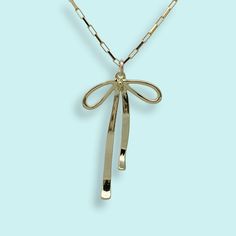 Ribbon bow on a gold box chain. Metal: 14kt gold-filled pendant, 14kt gold-filled chain Size: 1" long pendant Lobster clasp Available on 16", 18", or 20" chain (18" Fits Most) Nickel Free Knife Necklace, Antique Gold Earrings, Galentines Gifts, State Necklace, Compass Necklace, Bow Necklace, Gold Box, Moon Jewelry, Antique Earrings