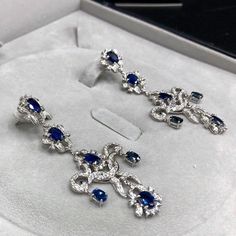 ENJOY OUR WORRY-FREE SERVICE AND THE DAZZLING, GENUINE JEWELRY WE DESIGN AND HANDCRAFT WITH LOVE❤️ ABOUT THE ITEM: A true MASTERPIECE, CHANDELIER EARRINGS, FEATURING 12 PIECES OF TOP GRADE, VIVID BLUE, FULLY TRANSPARENT, SIAMESE BLUE SAPPHIRES, weighting a total of 10.42 carats & over 232 pieces of E/VS DIAMONDS. With total diamonds weight at a WHOOPING 2.61 carats!! Set in ONE OF A KIND 18K SOLID WHITE GOLD, ENORMOUS CHANDELIER EARRINGS! (18 grams of gold weight) WORLD-CLASS MASTERPIECE NOW Luxury Oval Sapphire Diamond Earrings, Luxury Platinum Blue Earrings, Luxury Blue Platinum Earrings, Luxury Sapphire Diamond Earrings, Elegant Blue Platinum Earrings, Blue Platinum Earrings For Wedding, Luxury Oval Sapphire Earrings, Luxury Blue Diamond Earrings With Brilliant Cut, Luxury Sapphire Earrings