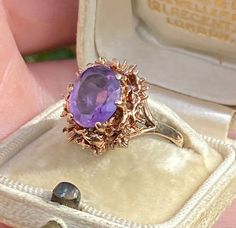 This is a fabulous and unique, 9ct Gold Brutalist design ring with a large oval Amethyst in the centre.  Brutalism was an offshoot of Modernism and originally applied to a type of raw, abstract and often angular architecture originating in the 1940s. The gold mounting on this ring is typically jagged and abstract in design and stands proud off the finger, giving the ring a feel of substance.  Size US 7.75, UK P The amethyst is prong set and measures 1.1cm x 9 mm. The head of the ring measures approximately 1.5 x 1.4cm and stands 8mm off the finger. Fully hallmarked for 9ct 375 gold, assayed in Birmingham in 1972/3 Lovely vintage condition Weight: 4.2g Comes gift-boxed, making a wonderful gift for, an anniversary or a birthday. Any boxes shown in the photos are for display only. Please stud Victorian Style Amethyst Ring Stamped 14k, Victorian Style 14k Stamped Amethyst Ring Gift, Victorian 14k Gold Amethyst Ring Collectible, Antique Amethyst Ring In Yellow Gold For Gift, Antique Amethyst Birthstone Ring As Gift, Angular Architecture, Amethyst Ring Vintage, Brutalist Design, Antique Brooches