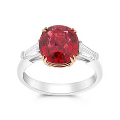 This three-stone style ring features a trio of glistening diamonds - the largest being an oval red spinel center stone set in a rose gold double cat claw setting with two trillion diamonds on either side. Surprise your loved one with this exclusive, hand-crafted dazzling piece. Available in all sizes. Send us yours! Luxury Ruby Three Stone Rings, Luxury Oval Three-stone Ruby Ring, Luxury Red Three Stone Jewelry, Luxury Red Three-stone Jewelry, Elegant Three Stone Red Diamond Ring, Elegant Three-stone Red Diamond Ring, Elegant Red Three-stone Diamond Ring, Elegant Red Three Stone Diamond Ring, Trillion Diamonds