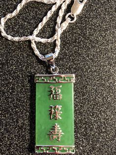 Beautiful Green Rectangular shape 1.18 x 0.625 inch Jade Sterling Silver Chinese Characters and Bezel with 20 in 2MM Sterling Sliver Diamond Cut Rope Chain from our personal collection of vintage jewelry Free priority Maill 2-3 Day shipping Formal Jewelry With Adjustable Chain And Rectangular Shape, Rectangular Sterling Silver Chain Jewelry, Green Rectangular Sterling Silver Jewelry, Rectangular Silver Jewelry, Engraved Silver Rectangular Jewelry, Formal Rectangular Jade Jewelry, Green Rectangular Pendant Jewelry For Anniversary, Formal Rectangular Chain Jewelry, Rectangular Green Jade Jewelry