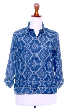 Slip into something special with Dani Paraswati's brightly patterned jacket. Woven in Java, the cotton jacket features an eye-catching indigo motif, a collared neckline, and two patch pockets for odds and ends. Lined in a cotton blend, the jacket is finished a concealed snap placket and three-quarter length sleeves. Patterned Ikat Print Long Sleeve Tops, Spring Cotton Ikat Print Top, Spring Ikat Print Long Sleeve Tops, Spring Long Sleeve Ikat Print Tops, Casual Ikat Print Patterned Top, Long Sleeve Cotton Top With Ikat Print, Cotton Ikat Print Long Sleeve Top, Patterned Jacket, Grey Eyes