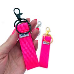 "Introducing a new style of key fob in all the bright colors you've come to know and love from Neon Sol! In place of the traditional key fob hardware is a matte black swivel lobster clasp (also available in silver and gold finishes) - perfect for securing your keychain to a belt loop, inside your purse, or anywhere that's convenient. SIZE * 3\" loop - suitable for slipping a few fingers through * overall length from bottom of loop to the end of the clip is 5\" FINISHES * Matte Black * Silver * Gold FEATURES Made with durable, high-quality soft nylon webbing and triple-stitched for durability. Includes split ring for attaching your keys! *Last photo is for size reference only - not color* MORE Discover all of our key fob colors and styles here: https://www.etsy.com/shop/neonsol/?section_id= Pink Keychain With Key Leash, Mini Keychain, Keychain Wristlet, Key Fobs Wristlet, Matte Black Hardware, Ziplock Bags, The Black Keys, Wristlet Keychain, Pink Mini