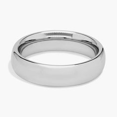 a white gold wedding ring on a white background