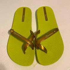 Ladies Sandals. Size 8/9. New, Never Worn, No Tags. Very Comfy, Flexible. Copperish Color Band With Lime Green Soles. Gold Flat Casual Flip Flops, Green Slip-on Summer Flip Flops, Green Flat Summer Flip Flops, Casual Gold Flip Flops For Beach Season, Green Flat Jelly Sandals For Beach, Casual Gold Flip Flops For Beach, Gold Flip Flops For Beach In Spring, Gold Cushioned Flip Flops For Vacation, Gold Jelly Sandals For Summer Beach