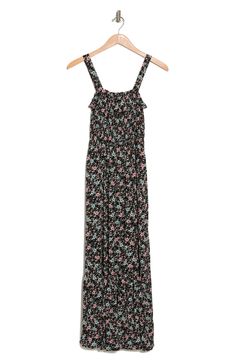 A sleeveless tiered maxi dress with an allover print. 52" length (size M) Square neck Sleeveless 100% rayon Machine wash Line dry Imported Model stats: 5'10" height, 32" bust, 25" waist, 36" hip. Model is wearing size M. Black Maxi Dress With Smocked Back And Spaghetti Straps, Flowy Sleeveless Rayon Maxi Dress, Sleeveless Viscose Dress With Adjustable Straps, Sundress With Ditsy Floral Print Maxi Length, Black Tiered Maxi Dress For Summer, Maxi Sundress With Ditsy Floral Print, Black Maxi Dress With Adjustable Straps, Casual Floral Print Patterned Maxi Dress, Summer Viscose Maxi Dress With Smocked Back