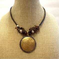 Excellent Condition- Like New. Necklace Measures 15” Plus 2” Extender. Pendant Measures 2 1/4” From Top To Bottom. Brown Faux Leather Chain, Gorgeous Wire Wrapped Glass Beads, And An Antique Gold Hammered Pendant. Nice Necklace! Check Out Other Items In My Closet! Over 3,000 Items- Mostly Jewelry ( But Not All)! Bundle For The Best Discount! ( 20% Off For 2 Or More Items). Questions? Leave A Comment Below! Inv Note:K5767. 240520 Elegant Brown Metal Beaded Necklace, Adjustable Round Brown Beaded Necklace, Adjustable Brown Beaded Round Necklace, Adjustable Brown Round Beaded Necklace, Adjustable Brown Beaded Necklace, Round Bronze Beaded Necklaces, Bronze Beaded Round Necklaces, Adjustable Gold Nickel-free Beaded Necklace, Adjustable Gold Beaded Necklace Nickel Free