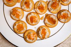 small appetizers are arranged on a white plate