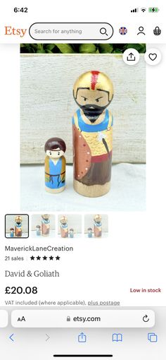 an image of a wooden toy with a man and woman in the middle on it