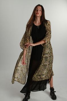 Animal Print Kimono Transparent fabric kimono with an animal print pattern in beige, black and yellow blooming, an open front, sleeves 3/4 with drooping shoulders, has a waist level tape so you can close if you wish.  - This long kimono is a hand-made piece, limited edition.  - Cloth Gauze, is a very light fabric with a perfect fall for this type of pieces  - One size   It adapts to different body types  - Watch out Hand wash cold #AnimalPrintKimono #kimono #KimonoDress #Animalprintdress Black Kimono For Beach Cover-up In Spring, Black Spring Kimono For Beach Cover-up, Black Kimono For Spring Beach Cover-up, Spring Beach Cover-up Black Kimono, Black Floral Print Wrap Kimono, Black Printed Summer Outerwear, Black Long Printed Kimono, Black Printed Long Kimono, Long Black Printed Kimono