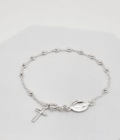 Catholic Sterling Silver Rosary Beads Cross Bracelet. This rosary has a decade of beads and a dangling cross charm. Sterling silver 925 ROSARY BRACELET with Cross and Virgin Mary Oval Medal, Prayer Beads, Catholic Jewelry, Medjugorje, Gift for her size of beads:2mm bracelet length: 19 cm (7,5") Check out our other items in Boutique Medjugorje store: https://boutiquemedjugorje.etsy.com Sterling Silver Rosary Bracelet Gift, Sterling Silver Rosary Bracelet With Round Beads, Sterling Silver Rosary Bracelet With Round Beads As Gift, Sterling Silver Rosary Bracelet With Silver Beads, Silver Rosary Bracelet With Silver Beads, Silver Rosary Bracelet For Jewelry Making, Silver Rosary Bracelet With 8mm Beads As Gift, Spiritual Sterling Silver Rosary Bracelet With Silver Beads, Spiritual Round Rosary Bracelet With Polished Beads