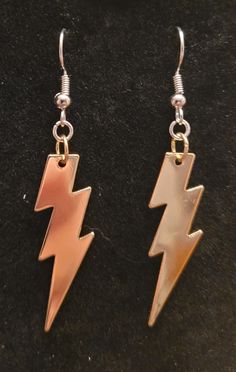 Large golden lightning bolt earrings. Lightning Jewelry, Birthday Plan Ideas, Mcqueen Costume, Lightning Mcqueen Costume, Golden Lightning, Bolt Earrings, Denki Kaminari, Frankie Stein, Lightning Bolt Earrings