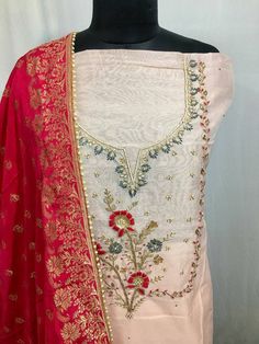 Item Overview ATHARVA Hand Embroidered Salwar Kameez /Neck Embroidery Peach/Reds Banarsi Silk Dupatta/Custom Stitch/Bridal Trousseau/Tassels/ CH1296 Fabric: * Shirt Chanderi Silk- Peach - 2.5 Mts - with Beautiful Neck embroidery. * Dupatta: Banarsi Silk Dupatta- Motifs may wary- Red * Bottom Santoon Silk Salwar 2.5 Mts. Excusive Hand Embroidered Party Wear Punjabi Suit. Customization: * Fabrics Customization: Designs Can be made in different Fabrics. * Color Customization: Designs Can be made in Festive Floral Embroidered Sharara For Traditional Ceremonies, Embroidered Border Dola Silk Sharara For Traditional Ceremonies, Traditional Dola Silk Sharara With Embroidered Border, Transitional Dola Silk Salwar Kameez With Embroidered Border, Dola Silk Sharara With Embroidered Border For Traditional Ceremonies, Pink Chinon Sets With Floral Embroidery, Semi-stitched Churidar With Embroidered Border, Traditional Embroidered Churidar In Chinon, Semi-stitched Churidar With Embroidered Border In Chinon