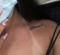 a woman with a cross tattoo on her chest