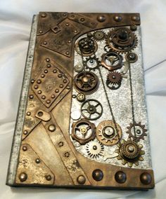 a metal book with gears and chains on it